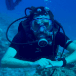 Scuba diver with equipment underwater. - CertiDive